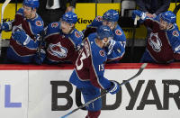 Colorado Avalanche right wing Valeri Nichushkin, front, is congratulated for a goal against the Winnipeg Jets during the third period of Game 3 of an NHL hockey Stanley Cup first-round playoff series Friday, April 26, 2024, in Denver. (AP Photo/David Zalubowski)