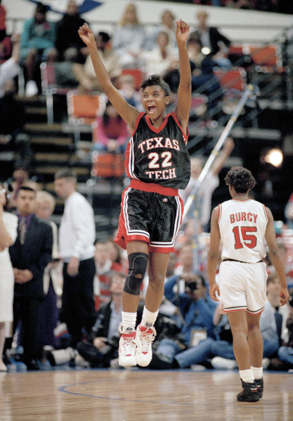 FILE - Texas Tech's Sheryl Swoopes leaps with joy as Ohio State's Audrey Burcy (15) walks off the court after Texas Tech defeated Ohio State 84-82 to win the Women's NCAA Division 1 basketball title in Atlanta, April 4, 1993. Swoopes scored 47 points in the game and was named the tournament MVP. Iowa's Caitlin Clark will soon be the NCAA's scoring leader. That's fact and, in many minds, enough to put the 22-year-old star high up among the greats of college basketball. (AP Photo/Elise Amendola, FIle)