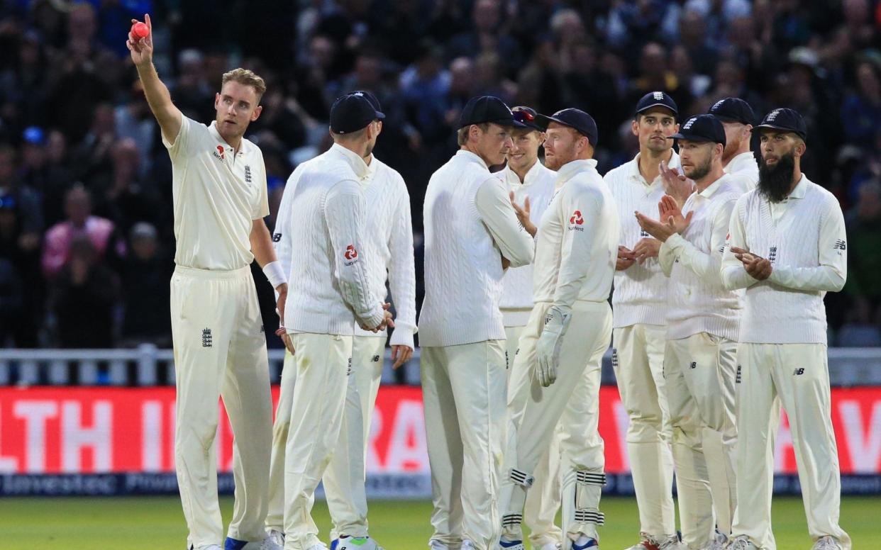 Going past a great: Stuart Broad salutes the crowd and his loved ones after passing Sir Ian Bothan on 384 Test wickets - AFP