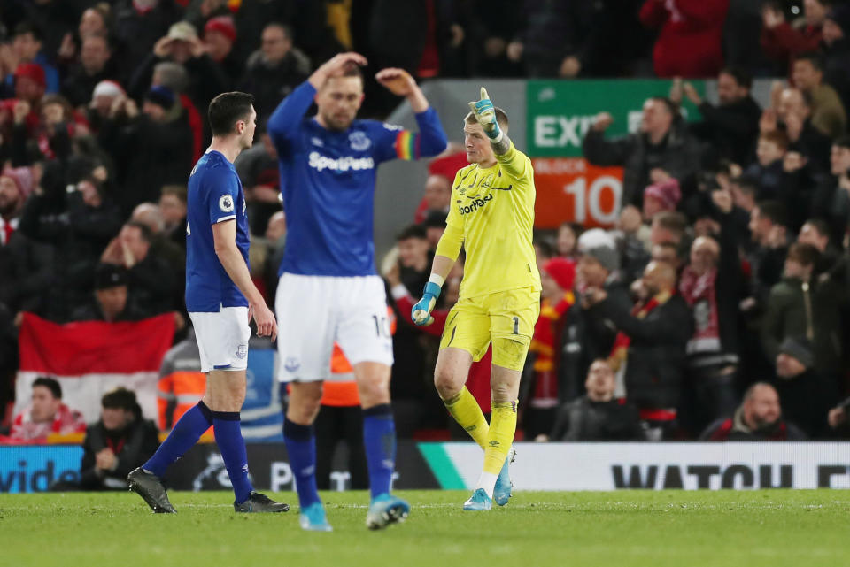 Soccer Football - Premier League - Liverpool v Everton - Anfield, Liverpool, Britain - December 4, 2019  Everton's Jordan Pickford remonstrates with Michael Keane as Gylfi Sigurdsson looks dejected   Action Images via Reuters/Lee Smith  EDITORIAL USE ONLY. No use with unauthorized audio, video, data, fixture lists, club/league logos or "live" services. Online in-match use limited to 75 images, no video emulation. No use in betting, games or single club/league/player publications.  Please contact your account representative for further details.