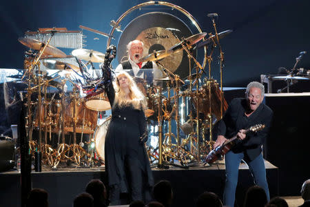 FILE PHOTO: Honorees Stevie Nicks, Mick Fleetwood, and Lindsey Buckingham of the group Fleetwood Mac perform during the 2018 MusiCares Person of the Year show honoring Fleetwood Mac at Radio City Music Hall in Manhattan, New York, U.S., January 26, 2018. REUTERS/Andrew Kelly/File Photo