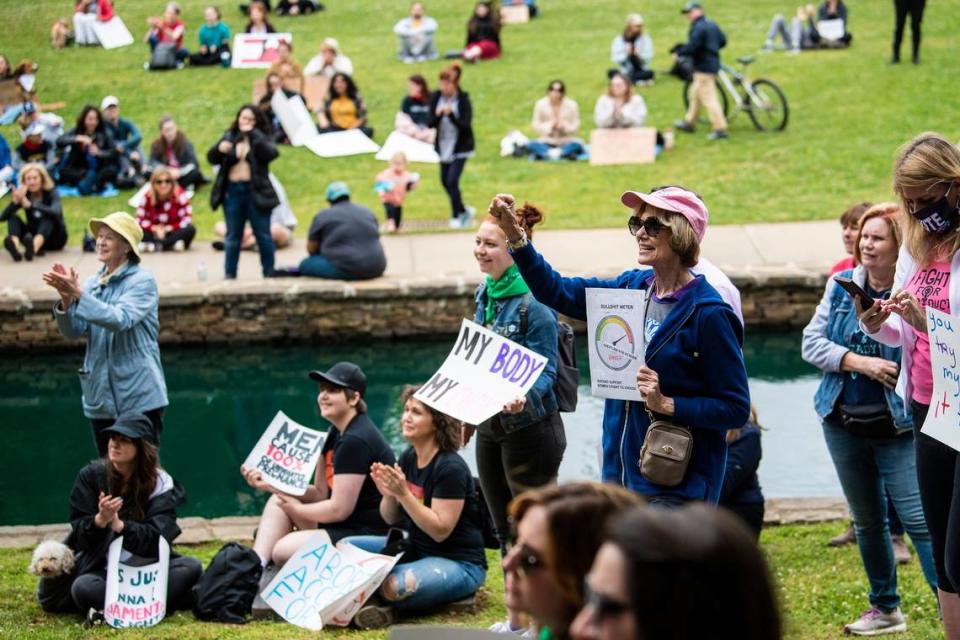 The crowd responds to a speaker during a Mothers Day rally for reproductive freedom at Freedom Park on Sunday, May 8, 2022 in Charlotte, NC.