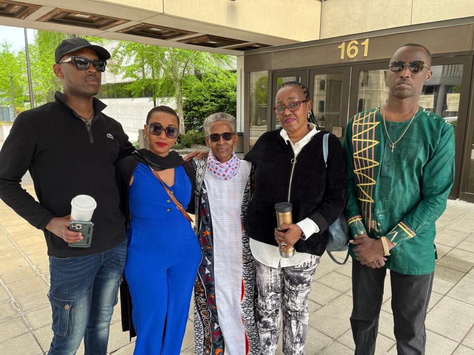 Ntwari's mother, Mélanie Rubavu (centre) and Muhoza's friend, Dieudonné Gasore (right) spoke to CBC following the hearing. 