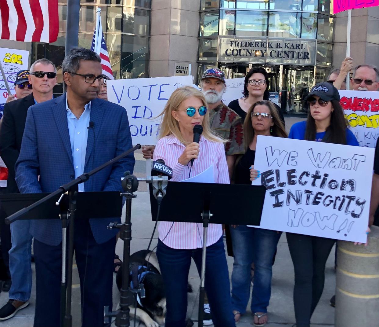 Defend Florida co-founder Caroline Wetherington speaks at a rally in Tampa on Thursday. The group has been investigating alleged “voting irregularities” in Florida and advocating for changes to election law based on their findings, but elections officials have dismissed their claims.