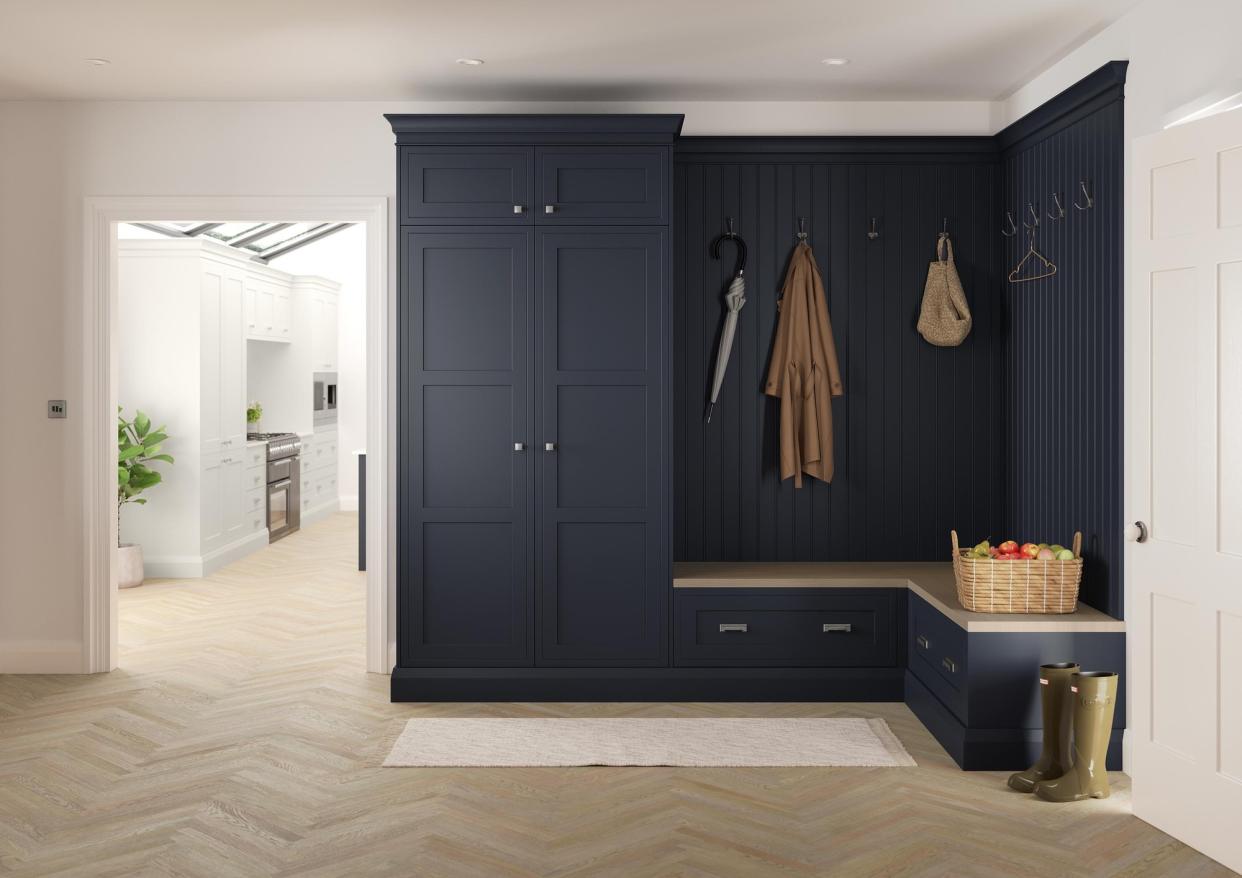  A mudroom cabinet painted a dark blue/grey. 