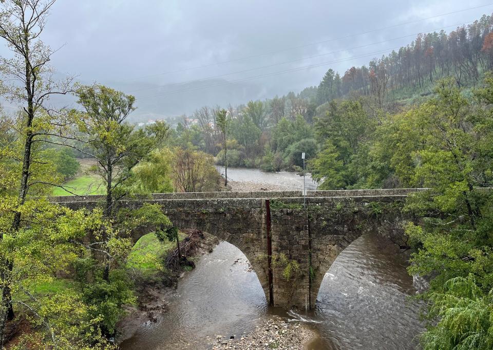 An old stone bridge crosses the Zêzere River in the Parque Nacional da Serra da Estrela near Valhelhas, Portugal on Sept. 17, 2023. (Kristen de Groot via AP)