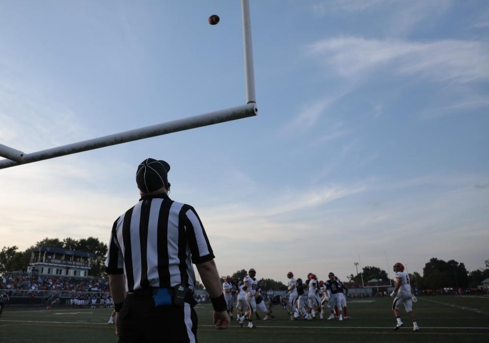 A referee watches as a Hartley point-after-touchdown sails through the uprights during the first quarter of an OHSAA high school football game between the Bishop Hartley Hawks and the Wheelersburg Pirates on Friday, August 31, 2018 at Bishop Hartley High School in Columbus, Ohio. [Joshua A. Bickel/Dispatch]