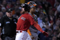 Boston Red Sox's Christian Arroyo celebrates after a two-run home run against the Houston Astros during the third inning in Game 3 of baseball's American League Championship Series Monday, Oct. 18, 2021, in Boston. (AP Photo/David J. Phillip)