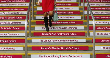 A delegate descends a flight of stairs during the Labour Party's annual conference in Manchester, northern England September 22, 2014. REUTERS/Darren Staples