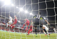 South Korea's defender Kim Min-Jae, left, scores the opening goal during the AFC Asian Cup group C soccer match between Kyrgyzstan and South Korea at Hazza Bin Zayed Stadium in Al Ain, United Arab Emirates, Friday, Jan. 11, 2019. (AP Photo/Hassan Ammar)