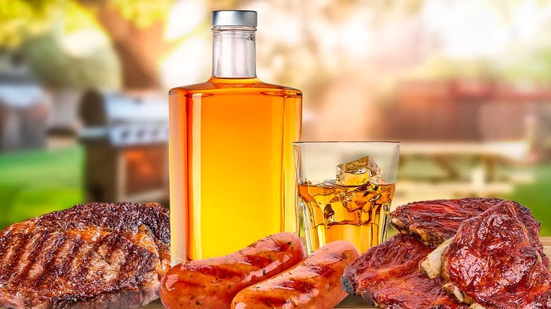 bottle of bourbon and barbecue meats