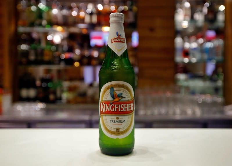 A Kingfisher beer bottle is pictured at a restaurant bar in Kolkata