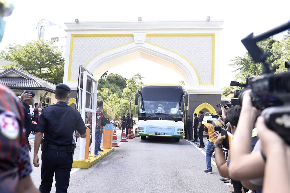 A bus carrying members of DAP is seen leaving Istana Negara on February 26, 2020. — Picture by Miera Zulyana