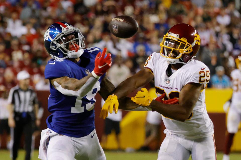 New York Giants wide receiver Kenny Golladay attempts to make a catch as Washington Football Team cornerback Kendall Fuller defends in the third quarter at FedEx Field.