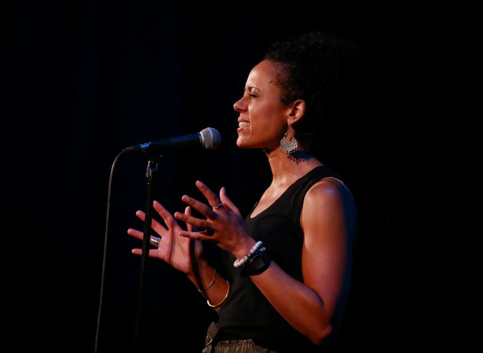 Akwi Nji shares her story of traveling to her childhood home in Cameroon during the Des Moines Register's Storytellers Project at Hoyt Sherman Place on Tuesday, June 14, 2022.