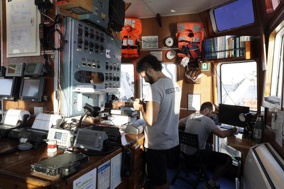 The crew of the Open Arms ship moored at the Naples harbor, Italy, Thursday, June 20,2 019. The Spanish NGO migrant ship Open Arms is in Naples with activists speaking to media and the public to mark World Refugee Day. (AP Photo/Andrew Medichini)