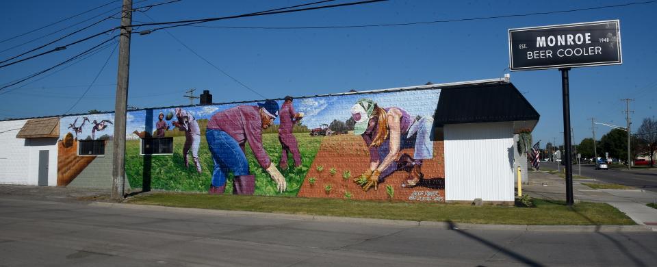 Renowned Detroit-area artist Jake Dwyer painted this large farm mural on the side of the Monroe Beer Cooler in Monroe last summer as part of the PLNTNG SEEDS program's inaugural year.