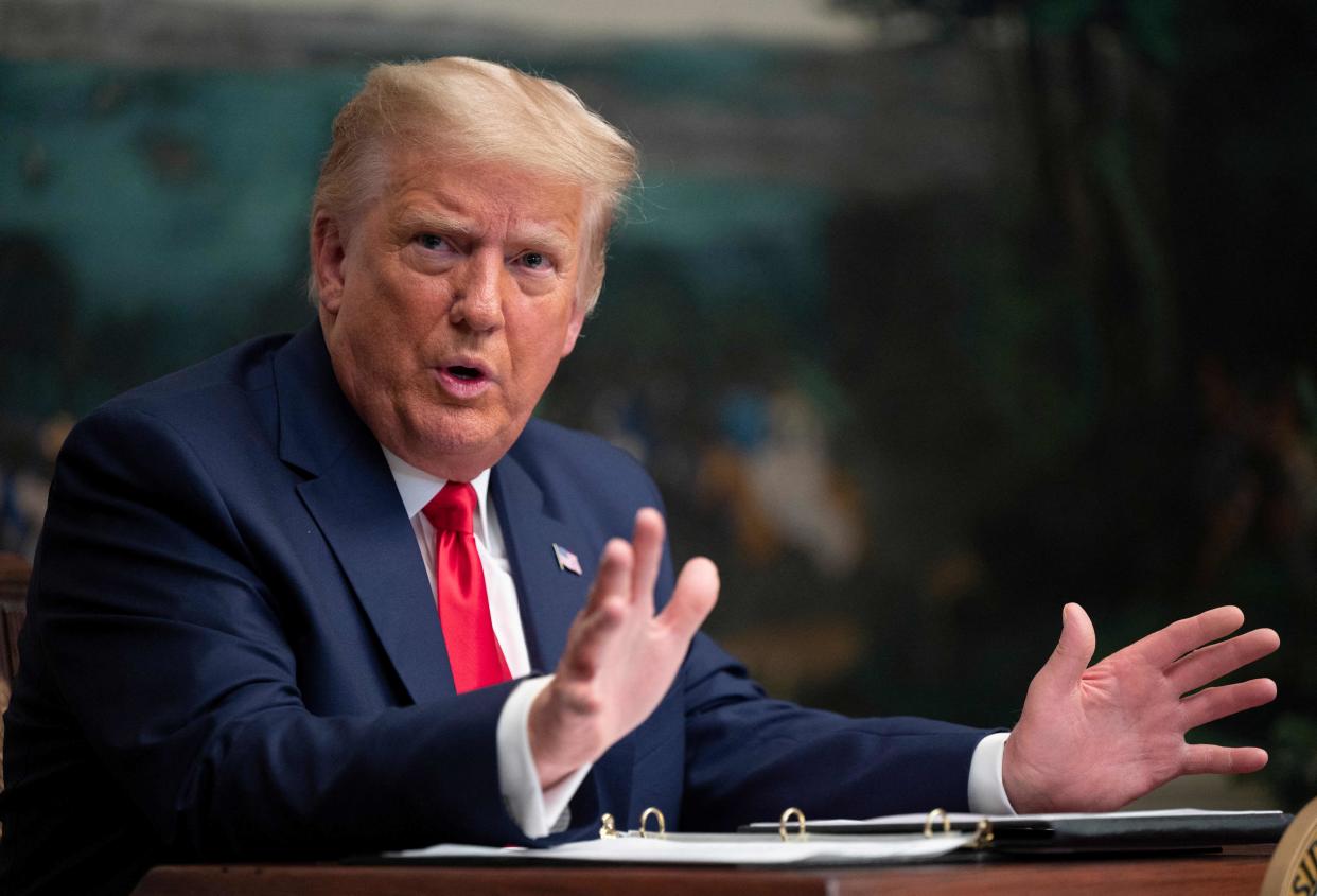 Donald Trump speaks to reporters at the White House on 26 November, 2020. (AFP via Getty Images)