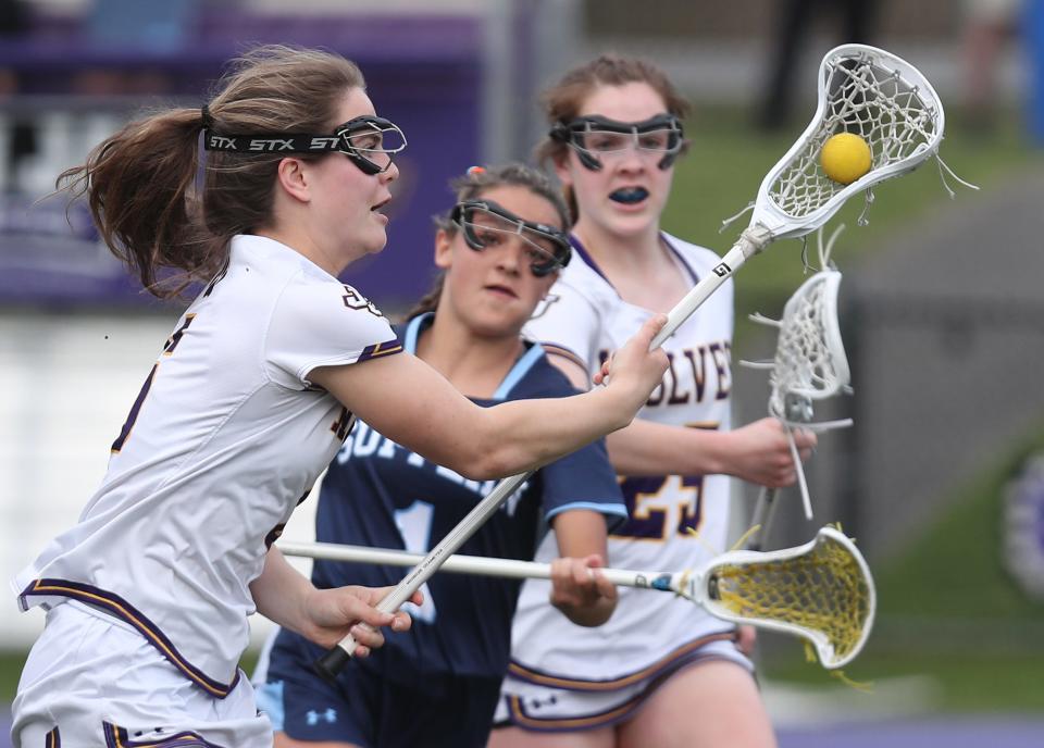 John Jay's Jo Jo Deal (6) drives to the goal against Suffern's during girls lacrosse action at John Jay High School in Cross River High  April 11, 2023. John Jay won the game 17-9.