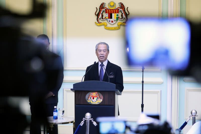 Malaysia's Prime Minister Muhyiddin Yassin speaks during his cabinet announcement in Putrajaya