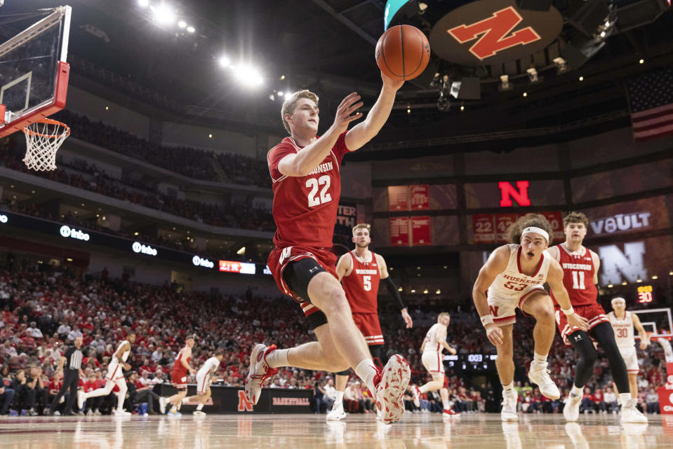 Wisconsin's Steven Crowl (22) reaches for a loose ball against Nebraska during the first half of an NCAA college basketball game Thursday, Feb. 1, 2024, in Lincoln, Neb. (AP Photo/Rebecca S. Gratz)