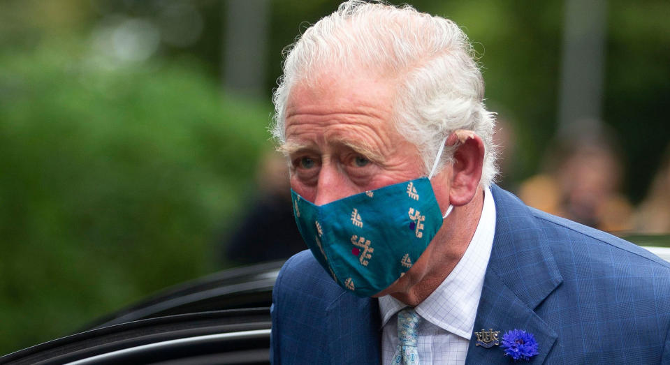 Britain's Prince Charles, Prince of Wales wears a face mask or covering due to the COVID-19 pandemic as he exits a car upon arrival to visit the Ulster Museum in Belfast on September 30, 2020. (Photo by Ian Vogler / POOL / AFP) (Photo by IAN VOGLER/POOL/AFP via Getty Images)