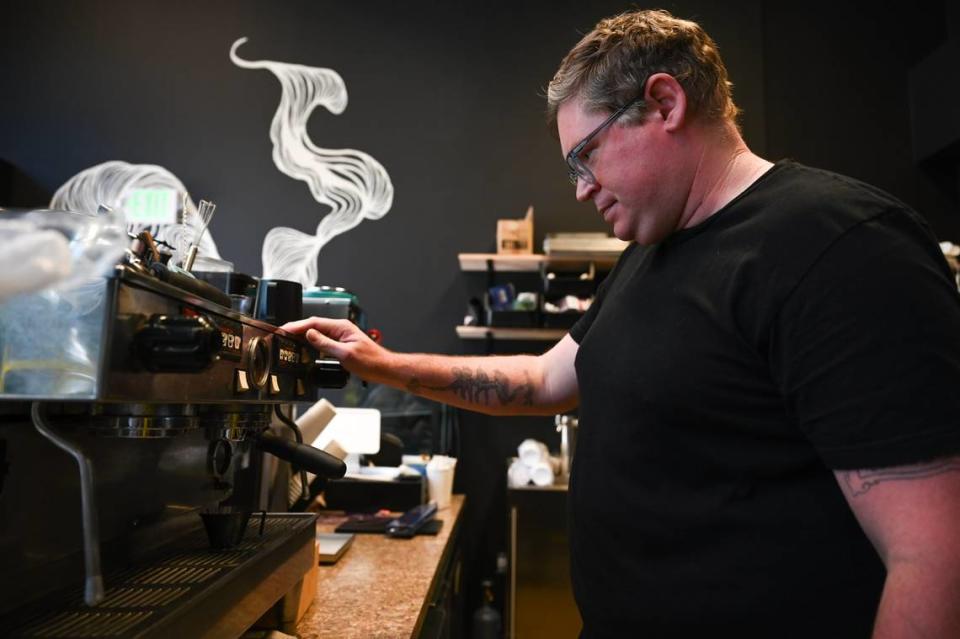 Mike Murphy, owner of Outer Dark Coffee, pulls a shot of espresso inside the soon-to-open Outer Dark Coffee cafe at 750 Market St. in downtown Tacoma.