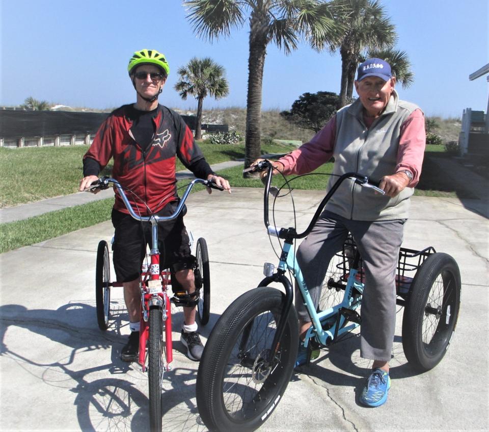 The author (left) is joined by neighbor Bill Wingate in a recent version of "play," riding three-wheeled bikes. A bike shop owner loaned Longenecker the trike to aid in his recovery from an injury, after subsequent complications left him unable to safely ride a standard two-wheel bicycle.