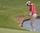 Hyo Joo Kim, of South Korea, chips onto the fifth green in the final round of the LPGA LOTTE Championship golf tournament at Ko Olina Golf Club, Saturday, April 19, 2014, in Kapolei, Hawaii. (AP Photo/Eugene Tanner)