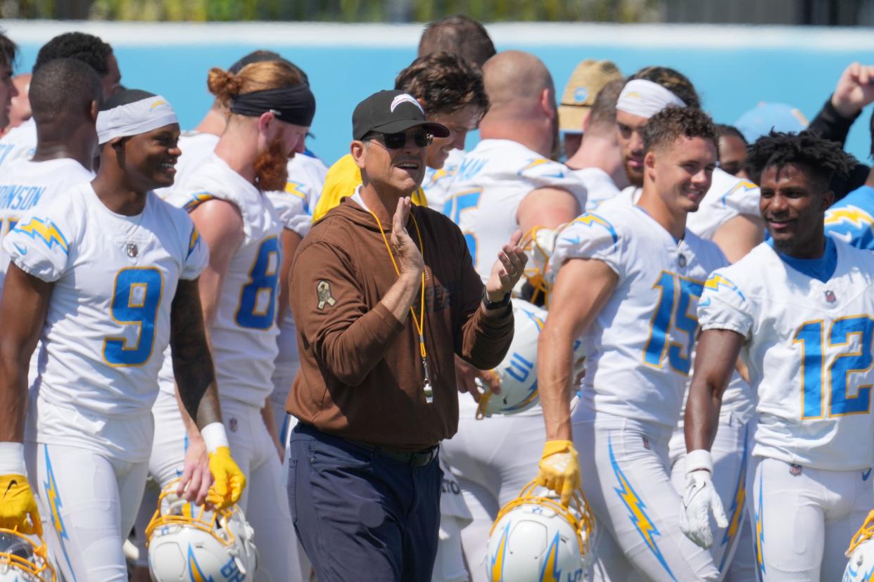Jun 13, 2024; Costa Mesa, CA, USA; Los Angeles Chargers head coach Jim Harbaugh interacts with his team during minicamp at the Hoag Performance Center. Mandatory Credit: Kirby Lee-USA TODAY Sports