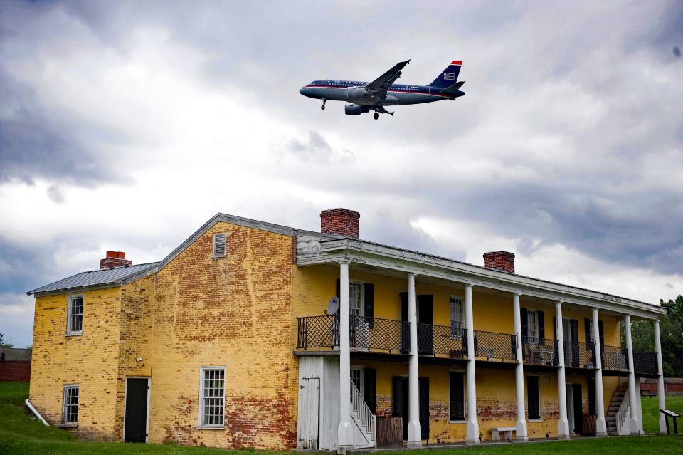 An airplane flies over Fort Mifflin (Pa.), a popular place for paranormal investigations.