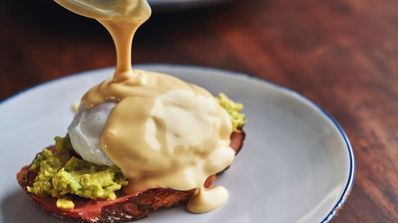 Eggs Benedict drizzled with Hollandaise