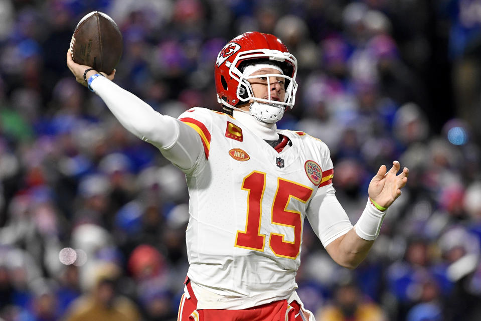 Kansas City Chiefs quarterback Patrick Mahomes (15) passes against the Buffalo Bills during the first quarter of an NFL AFC division playoff football game, Sunday, Jan. 21, 2024, in Orchard Park, N.Y. (AP Photo/Adrian Kraus)