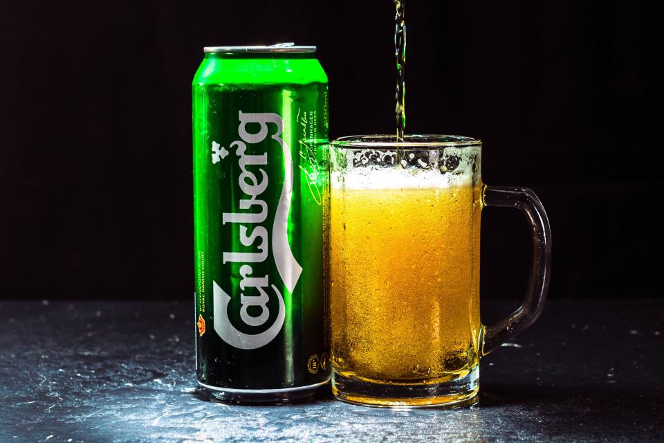 Can of Carlsberg beer and beer glass 