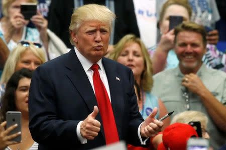 Republican presidential nominee Donald Trump attends a campaign rally in Akron, Ohio, U.S., August 22, 2016. REUTERS/Carlo Allegri