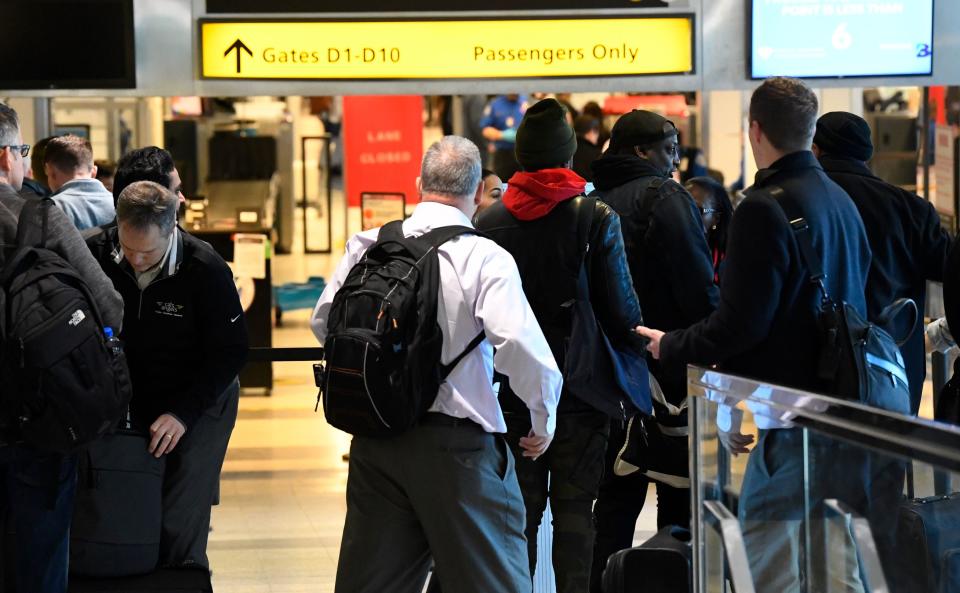 Passengers move through Central terminal B security check-in at New York’s LaGuardia Airport.