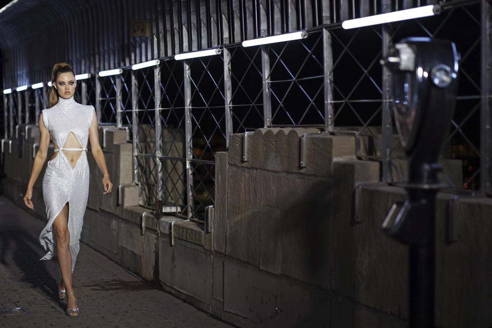 The LaQuan Smith collection is modeled at the Empire State Building during New York Fashion Week on Thursday, Sept. 9, 2021, in New York. (Photo by Charles Sykes/Invision/AP)