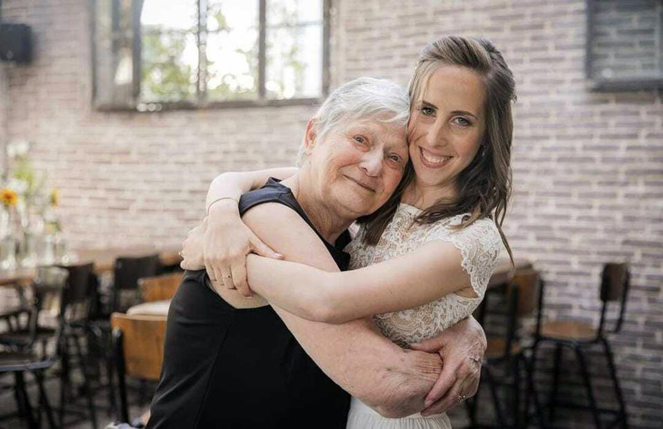 In this handout photo provided by Adva Adar and Elinor Shahar Personal Management, Yaffa Adar, left, hugs her granddaughter Adva Adar during her wedding, in 2021. Yaffa Adar is the elderly woman the world saw being driven by Hamas militants in a golf cart hours after they murdered Israelis in southern Israel on Oct. 7, 2023. (Adva Adar and Elinor Shahar Personal Management via AP)