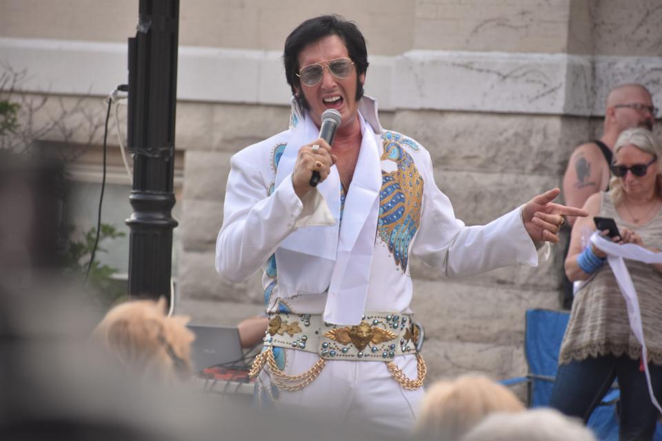 Elvis Presley impersonator Matt King, whose residence is in Dearborn Heights, Michigan and whose real name is Matthew J. Chantelois, performs on June 2, 2023, during a "Hot Wheels" First Fridays promotional event in the city of Adrian, in southwestern Michigan. Chantelois has been charged in federal court in Erie with six counts related to the sexual exploitation of a minor.