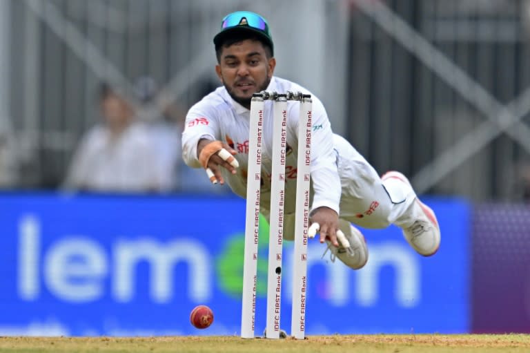 Bangladesh's Zakir Hasan dives during the first day of the first Test cricket match between India and Bangladesh (R.Satish BABU)