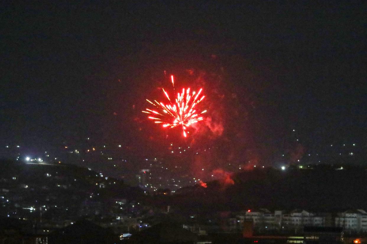 Celebratory gunfires light up part of the night sky after the last US aircraft took off from the airport in Kabul early on Aug. 31, 2021.