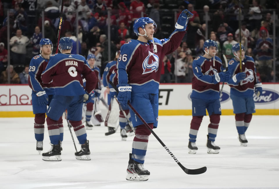 Colorado Avalanche right wing Mikko Rantanen, center, gestures after the third period of an NHL hockey game against the Detroit Red Wings, Monday, Jan. 16, 2023, in Denver. (AP Photo/David Zalubowski)