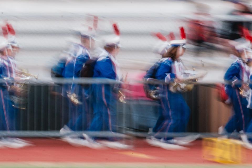 The West Holmes High School marching band enters Quaker Stadium during week 9 high school football action, Friday, Oct. 13 in New Philadelphia, Ohio.