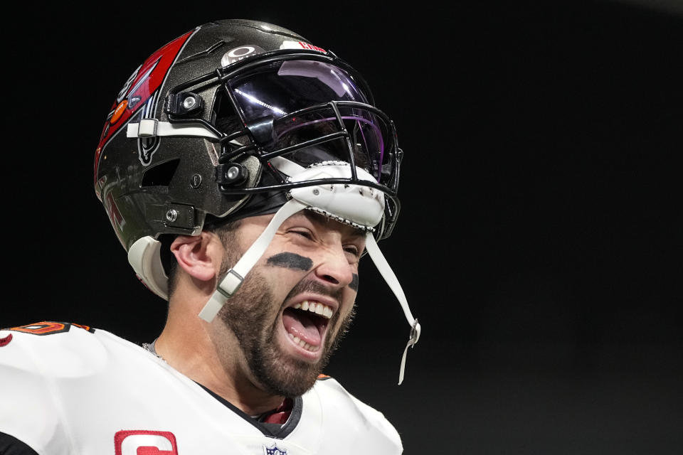 Tampa Bay Buccaneers quarterback Baker Mayfield (6) laughs with teammates before plaing the Atlanta Falcons in an NFL football game, Sunday, Dec. 10, 2023, in Atlanta. (AP Photo/Brynn Anderson)