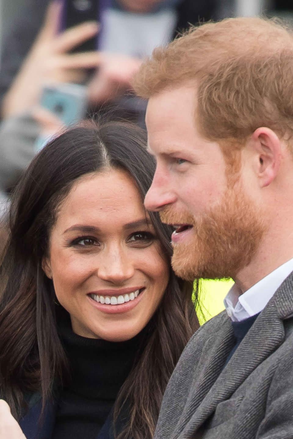 Meghan Markle smiles at Prince Harry during a visit to Edinburgh Castle in Scotland.