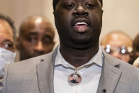 Brandon Williams, nephew of George Floyd, wears a pendant bearing the likeness of his uncle during a news conference after former Minneapolis police Officer Derek Chauvin is convicted in the killing of George Floyd, Tuesday, April 20, 2021, in Minneapolis. (AP Photo/John Minchillo)
