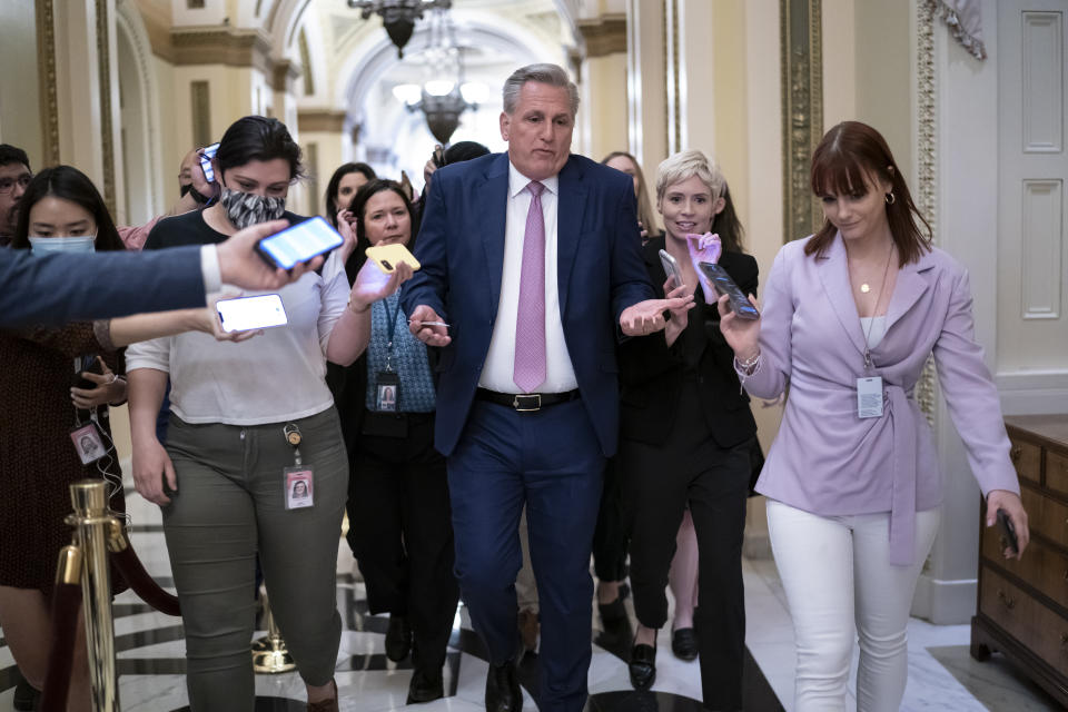 FILE - House Republican Leader Kevin McCarthy, R-Calif., rushes to his office with reporters in pursuit, at the Capitol in Washington, Thursday, May 12, 2022. The new 118th Congress, with Republicans in control of the House, begins Jan. 3, 2023, but the first task for the GOP is electing a new speaker and whether Kevin McCarthy can overcome opposition from conservative lawmakers in his own ranks to get the job. (AP Photo/J. Scott Applewhite, File)
