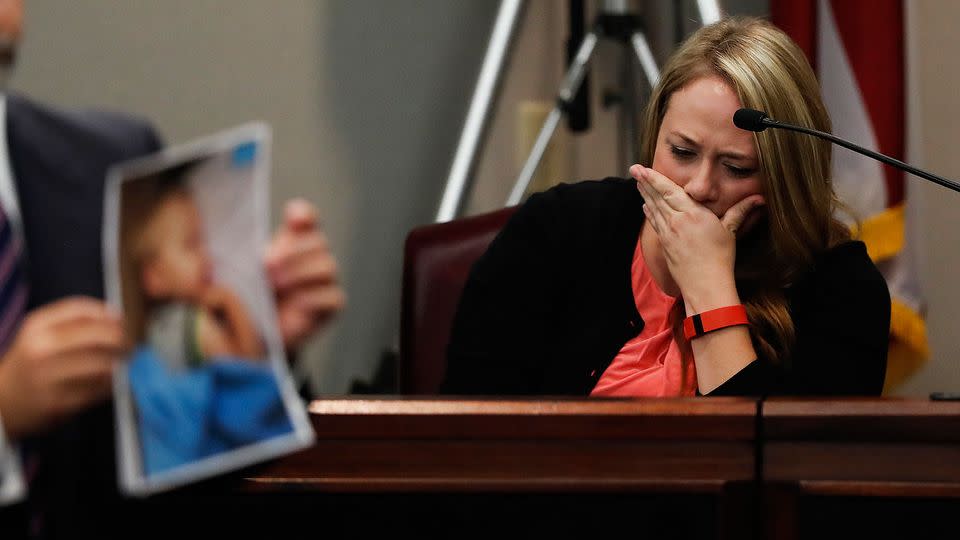 Leanna Taylor cries as an attorney shows photographs of her son Cooper to the jury during a murder trial for her ex-husband Justin Harris. Photo: AP/John Bazemore