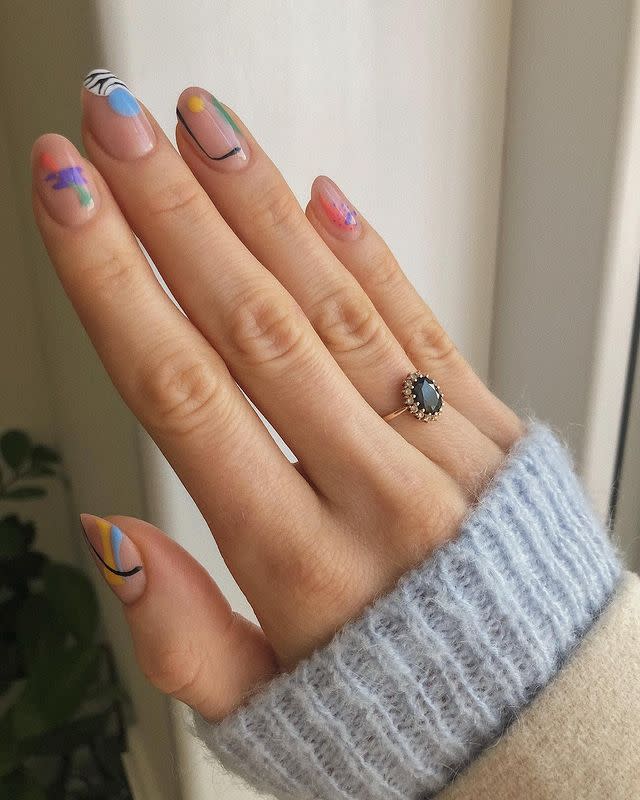 <p>This one is for our minimalist lovers — tiny and bright pops of color will look as amazing against your natural nail color as they will against any colorful base.</p><p><a href="https://www.instagram.com/p/B8OzpqYgzki/&hidecaption=true" rel="nofollow noopener" target="_blank" data-ylk="slk:See the original post on Instagram;elm:context_link;itc:0;sec:content-canvas" class="link ">See the original post on Instagram</a></p>