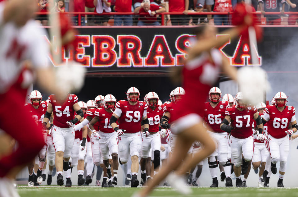 The Nebraska football team enters the field before playing against Louisiana Tech during an NCAA college football game, Saturday, Sept. 23, 2023, in Lincoln, Neb. (AP Photo/Rebecca S. Gratz)